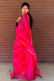 Rani pink to orange mul mul saree draped