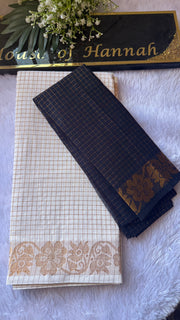 Navy Sungudi cotton saree folded to show the gold floral pallu